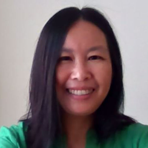 Crystal Wong wearing green sweater